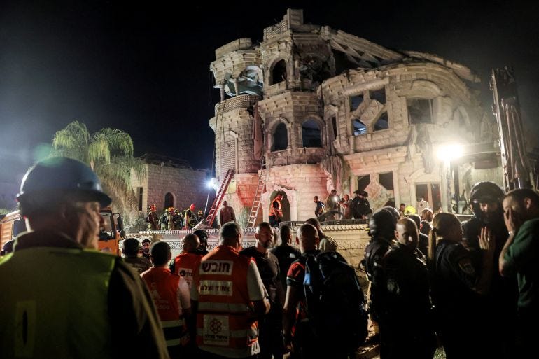 Rescue workers amid destruction after missile strikes in northern Israel Rescue workers amid destruction after missile strikes in northern Israel