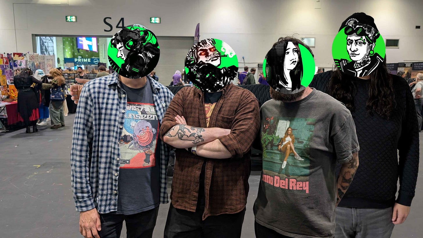 Four people standing in a row posing for a photo, with green discord avatars over their faces