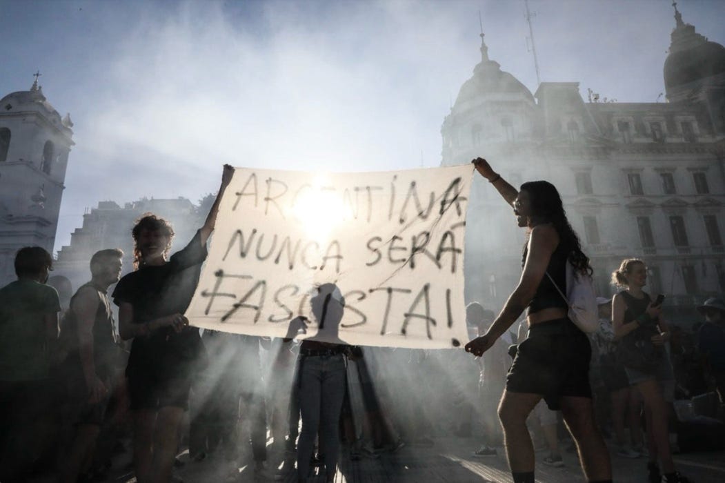 A group of people holding a sign
AI-generated content may be incorrect. A group of people holding a sign
AI-generated content may be incorrect.