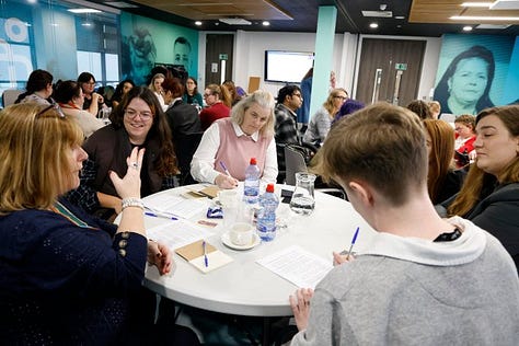 Images from the Disabled Women and Poverty event. Images include photos of group discussions and Alice reading a poem from the podium.