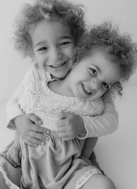 Images from L to right: black and white of the world's cutest niece and nephew hugging; an overpass, anti-hate protest, pickles the cat on his back being cute, a lone poppy in a sea of green, my son playing trumpet in band, the book From Dictatorship to Democracy