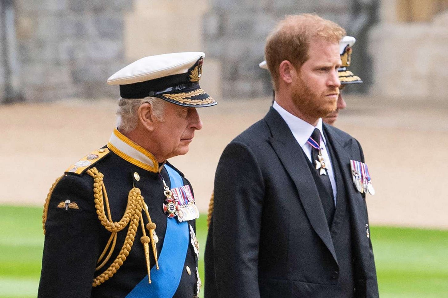Britain's King Charles III (L) walks with his son Britain's Prince Harry, Duke of Sussex as they arrive at St George's Chapel inside Windsor Castle on September 19, 2022