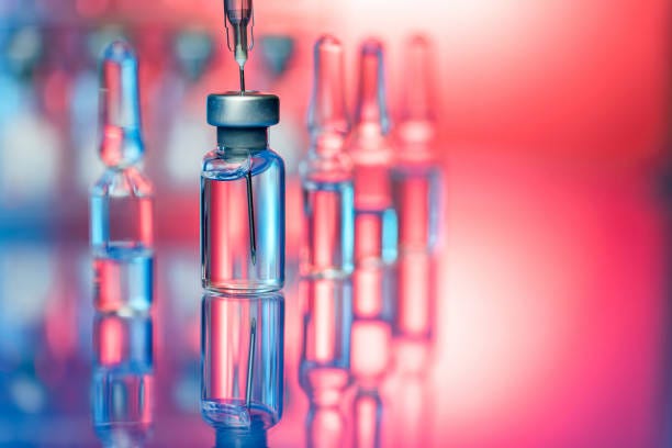 Vaccine in laboratory - flu shot and Covid-19 vaccination Close up shot of vaccines - glass bottles, ampules and syringe with needle. Good for illustration of flu shot, vaccination and covid-19 biological drugs stock pictures, royalty-free photos & images