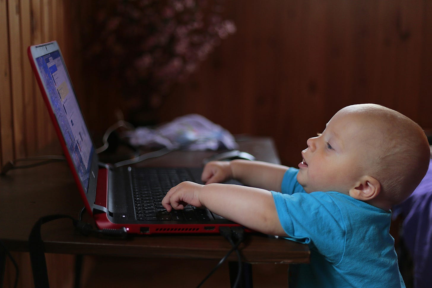 Baby tying on a laptop. Baby tying on a laptop.