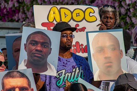 Citizens gather for a vigil to remember loved ones who have died in Alabama's prisons