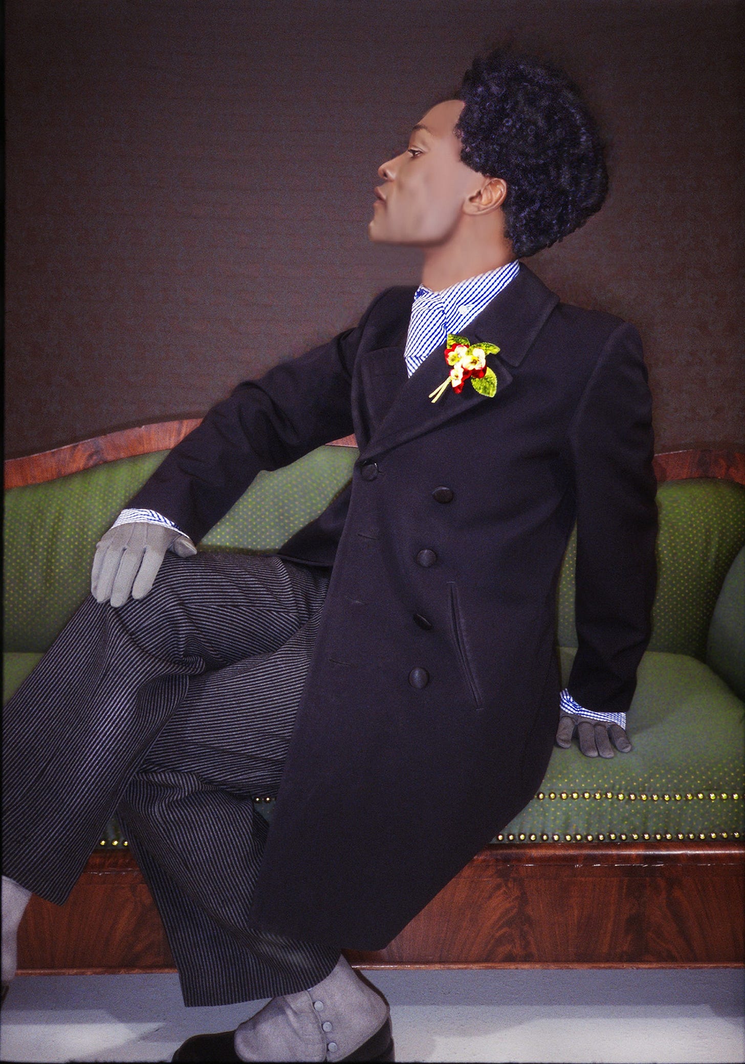 Image may contain Clothing Coat Blazer Jacket Couch Furniture Glove Adult Person Footwear Shoe and Overcoat