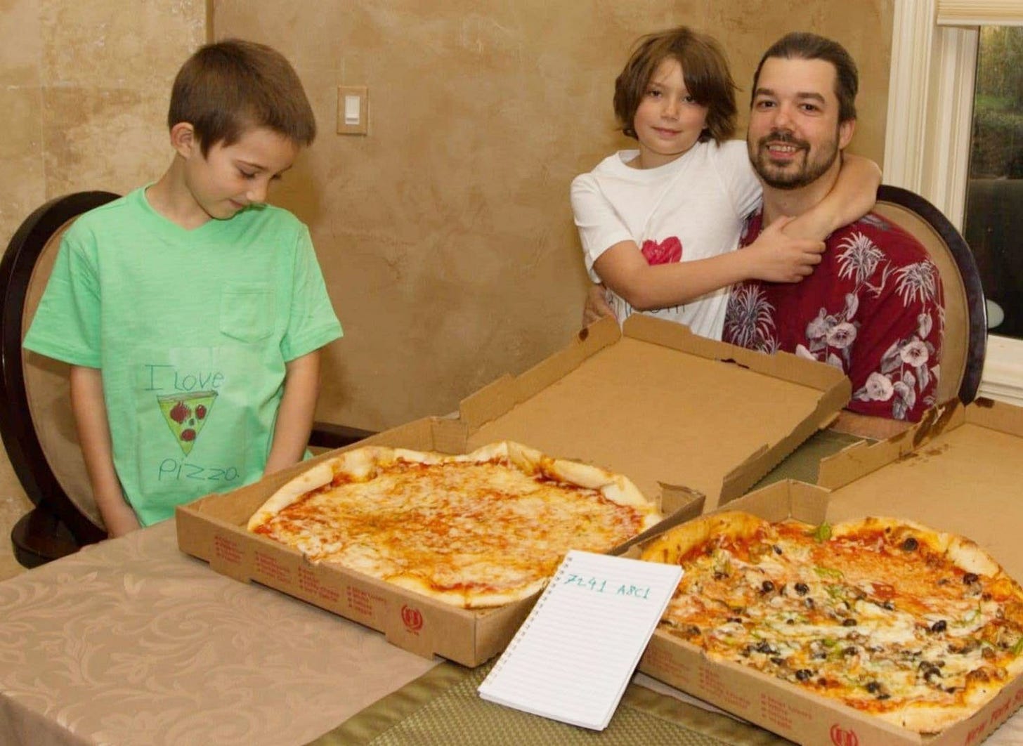 Laszlo Hanyecz and family enjoy 10000 BTC pizza.jpg