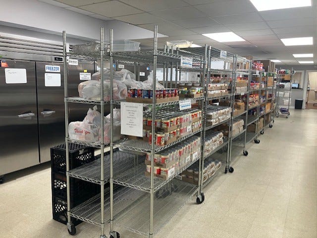 picture of FISH volunteers and food pantry