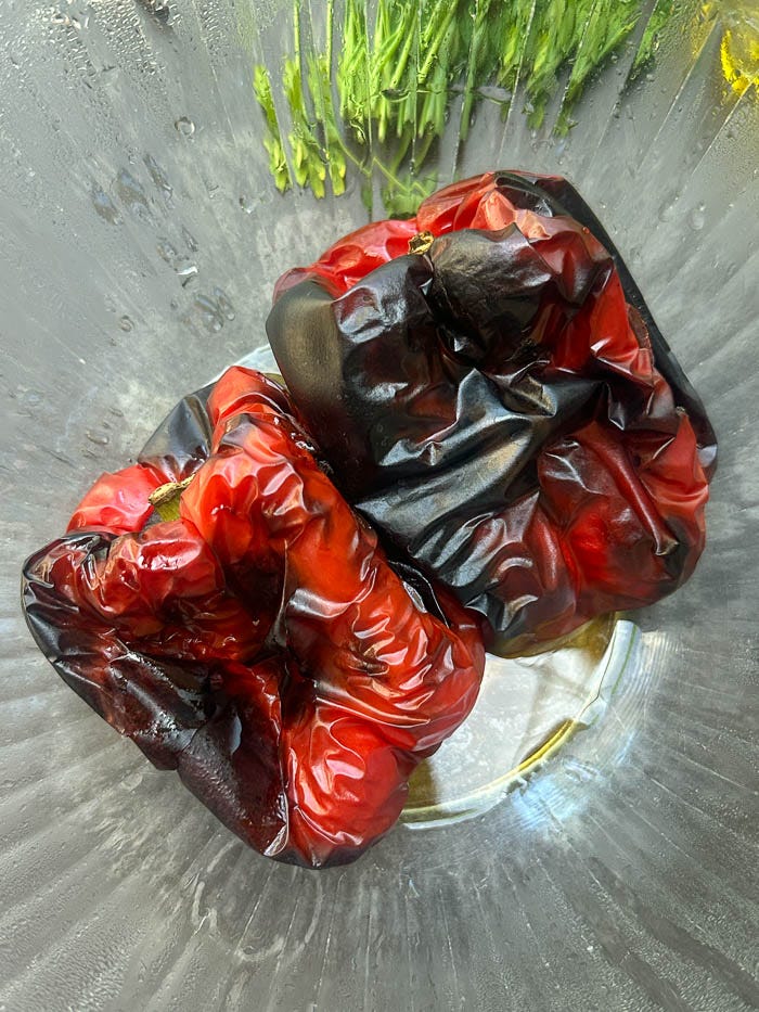 Sweet roasted red peppers marinated with garlic, herbs, and olive oil. An easy make-ahead recipe for sandwiches, salads, and snack boards. Full recipe on Shutterbean. Sweet roasted red peppers marinated with garlic, herbs, and olive oil. An easy make-ahead recipe for sandwiches, salads, and snack boards. Full recipe on Shutterbean.