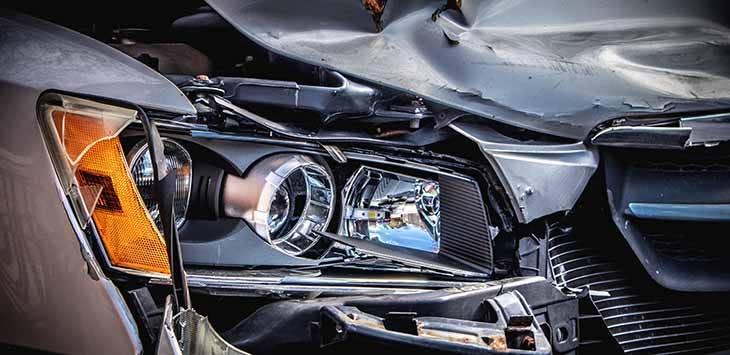 Photo of a crashed car.