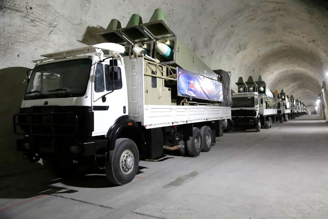 Missiles on mobile truck launchers on display at the base.