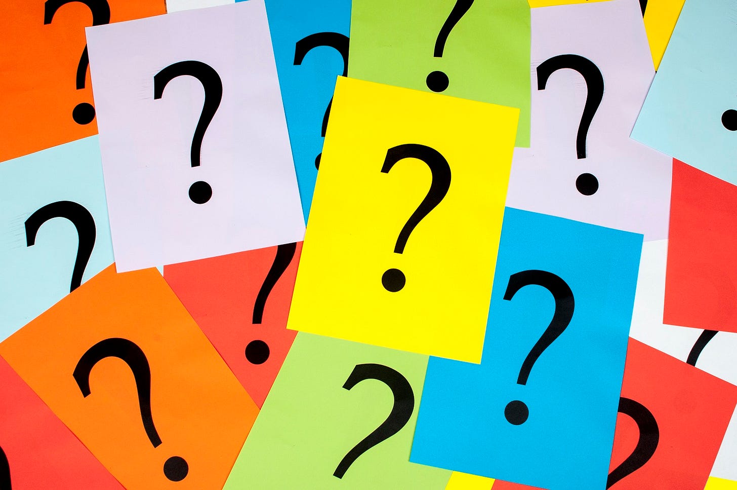 Many post-it notes with question marks on them.