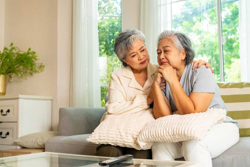 Elder comforting her friend in time of need. Elder comforting her friend in time of need.