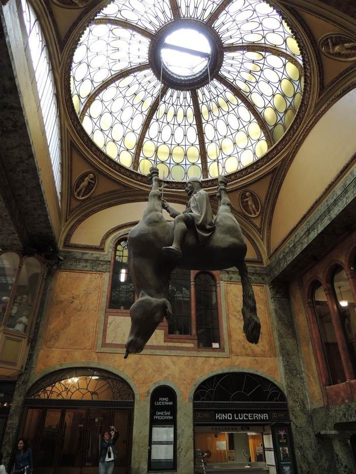A statue of a horse in a building

AI-generated content may be incorrect.