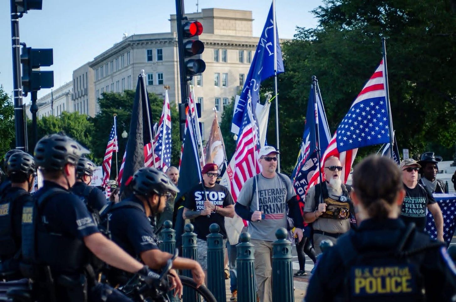 May be an image of 7 people, crowd and text that says 'የለዽን STOP PRE RE-NDIN MDINK YOU ETERANS ETERANS GAINST UMP UETROY DELTA TANGO' May be an image of 7 people, crowd and text that says 'የለዽን STOP PRE RE-NDIN MDINK YOU ETERANS ETERANS GAINST UMP UETROY DELTA TANGO'