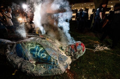 steam rises from a toppled statue