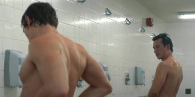Hudson Williams as Shane checks out Connor Storrie as Ilya in the locker room shower on 'Heated Rivalry.'