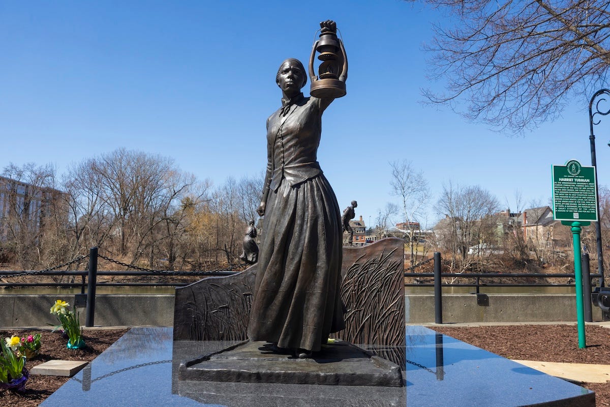 A newly revealed Harriet Tubman statue stands tall on the Downtown Binghamton Freedom Trail, a public trail highlighting important sites and people on the Underground Railroad. The statue was created by Zoe Dufour and features Tubman holding a lantern, symbolizing her as a beacon of hope and light in darkness. A newly revealed Harriet Tubman statue stands tall on the Downtown Binghamton Freedom Trail, a public trail highlighting important sites and people on the Underground Railroad. The statue was created by Zoe Dufour and features Tubman holding a lantern, symbolizing her as a beacon of hope and light in darkness.