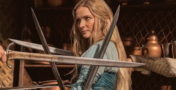 Morfydd Clark as Galadriel, teaching sword fighting in The Lord of the Rings: The Rings of Power, 2022