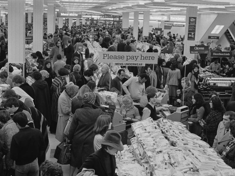 Having to do all your Christmas shopping in person meant it could get very busy. Like all these people who hit the stores in December 1976. 