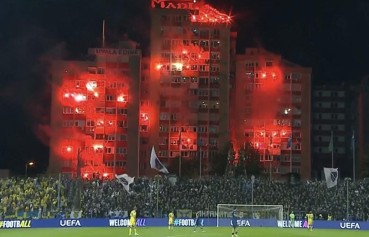 r/soccer - Bosnian fans lighting flares in the buildings behind the stadium in the 11th minute in honor of Edin Dzeko’s last game for his country r/soccer - Bosnian fans lighting flares in the buildings behind the stadium in the 11th minute in honor of Edin Dzeko’s last game for his country