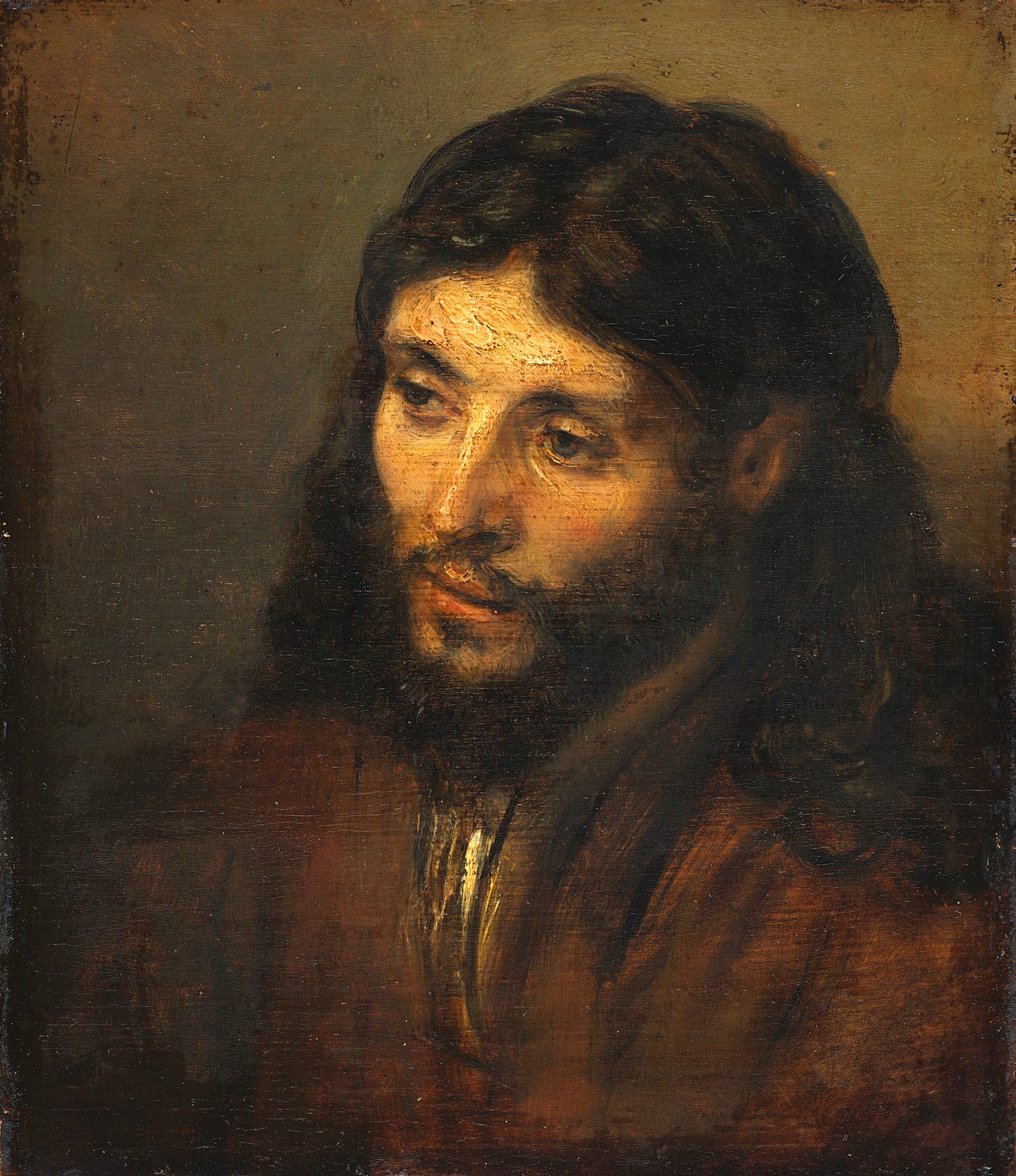 Rembrandt's Head of Christ, a quiet, human face in warm shadow.