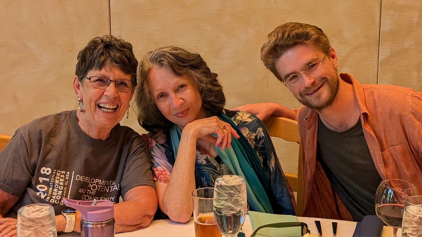 Image description: Linda Silverman, Fiona Smith, and Dominic Westbrook seated together at our final dinner