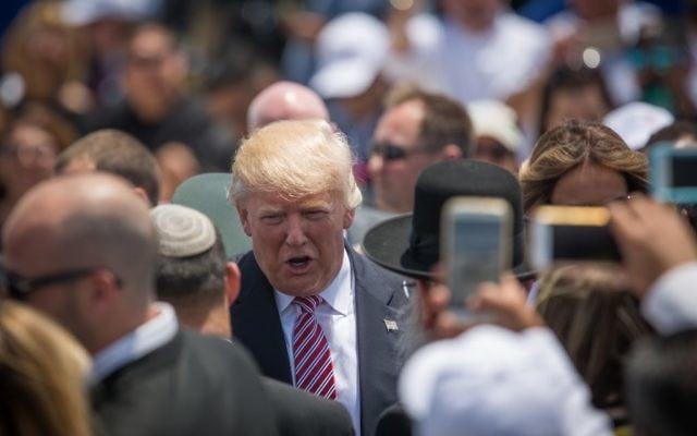 US President Donald Trump greeting Israeli ministers during his welcome ceremony at Ben Gurion Airport, May 22, 2017. (Hadas Parush/Flash90)