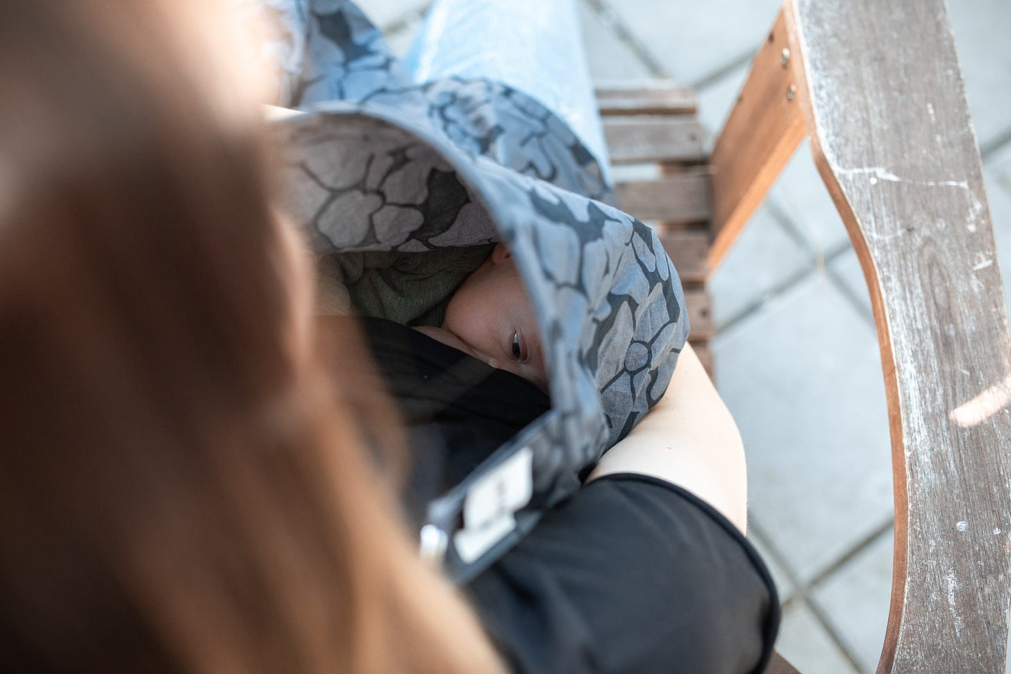 picture of baby breastfeeding outside