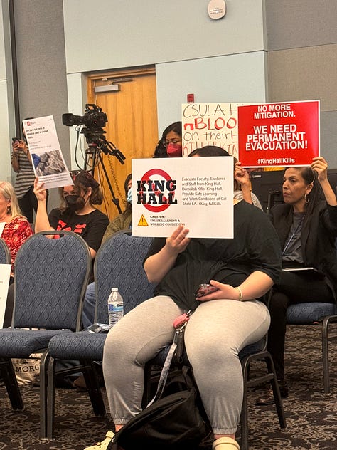 various photographs of the town hall, many people photographed holding signs that read concerns about the dilapidated building in question.