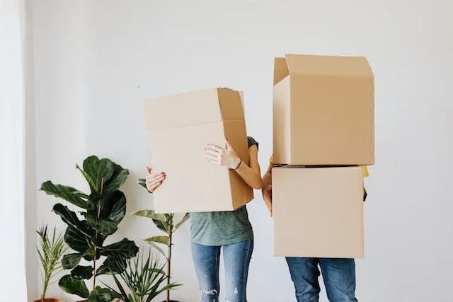 Relocating tips featuring a couple carrying boxes