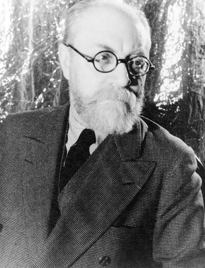 Older man in glasses and a coat Older man in glasses and a coat