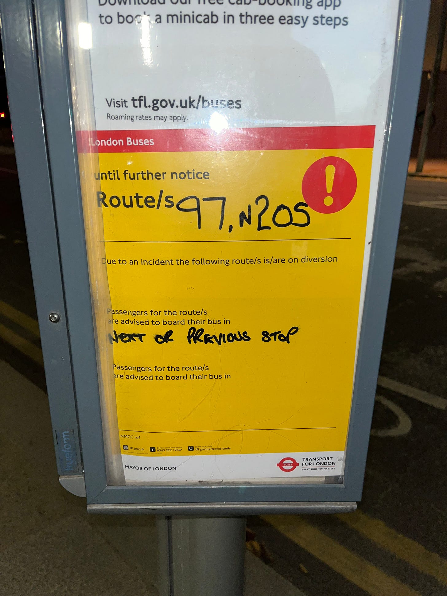 Photo of a partially completed diversion card in the bus stop's timetable holder.