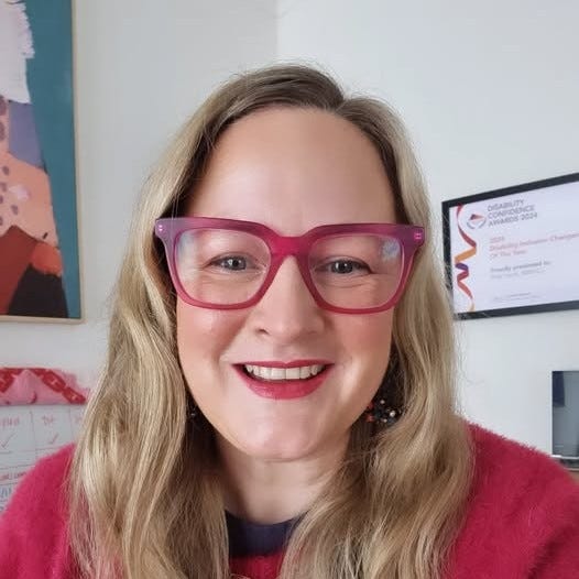 Alt text “Headshot of Briar smiling to camera”