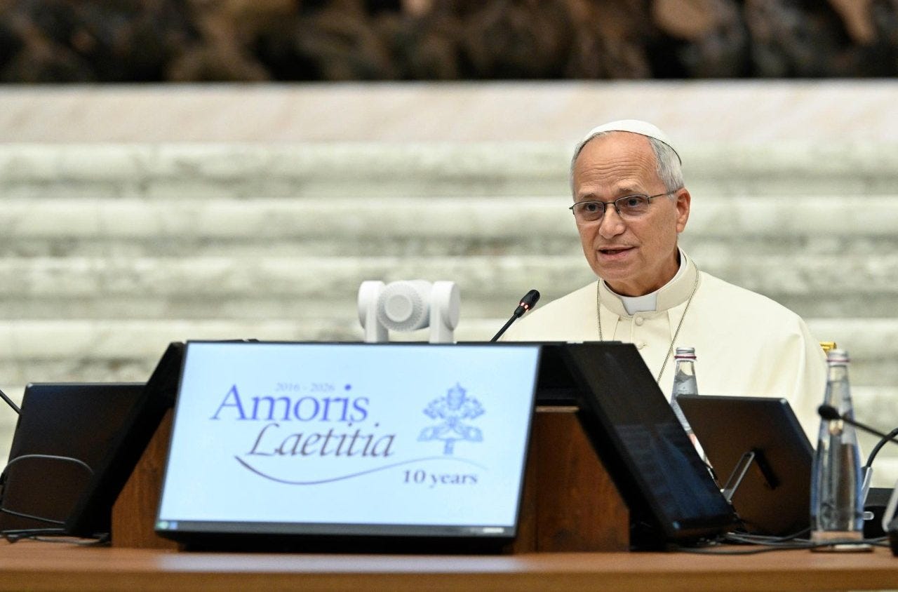 Pope Leo XIV speaks behind a placard marking 10 years of Amoris Laetitia Pope Leo XIV speaks behind a placard marking 10 years of Amoris Laetitia