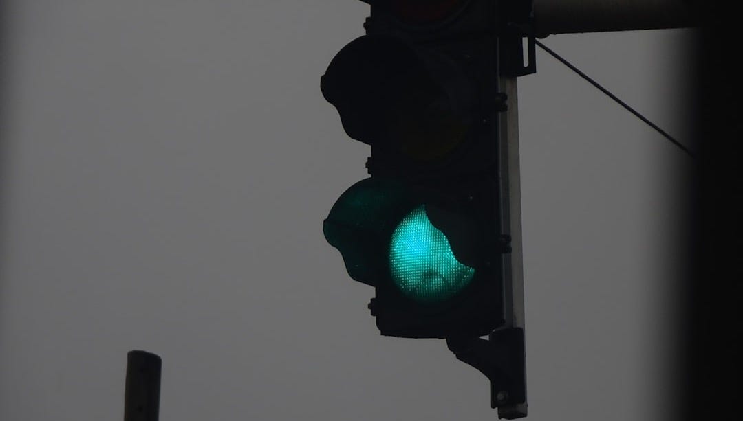 a traffic light with a green light on it a traffic light with a green light on it