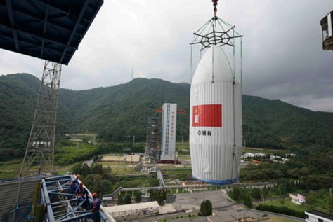 The Long March 2D 100th first-stage, second-stage, and fairing heading to and being placed onto Launch Complex 3.
