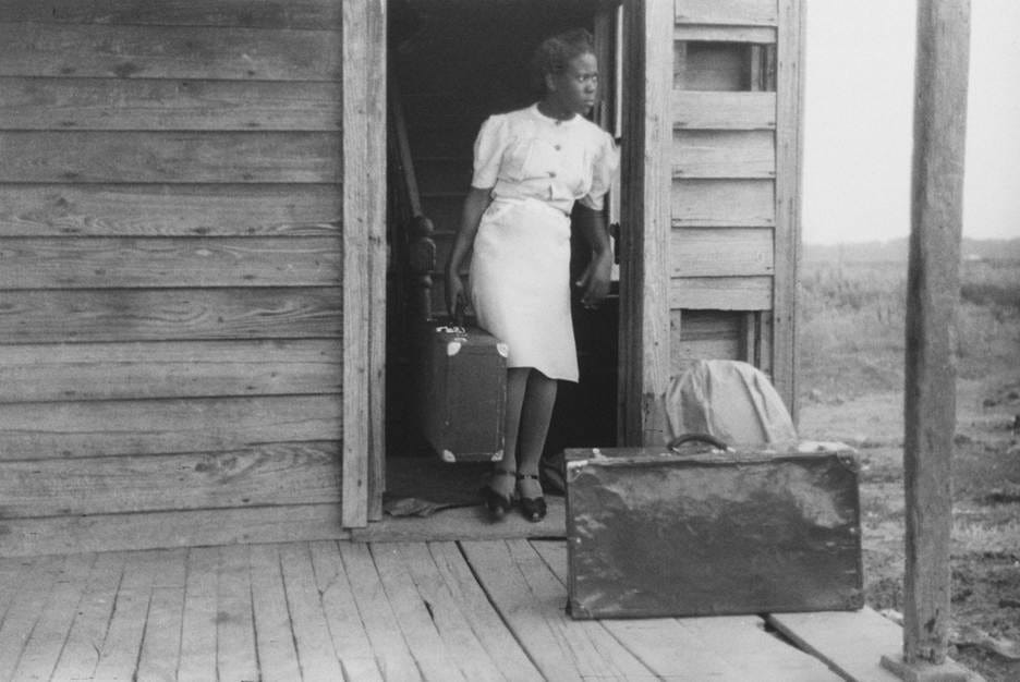 A person with luggage in a doorway

AI-generated content may be incorrect.