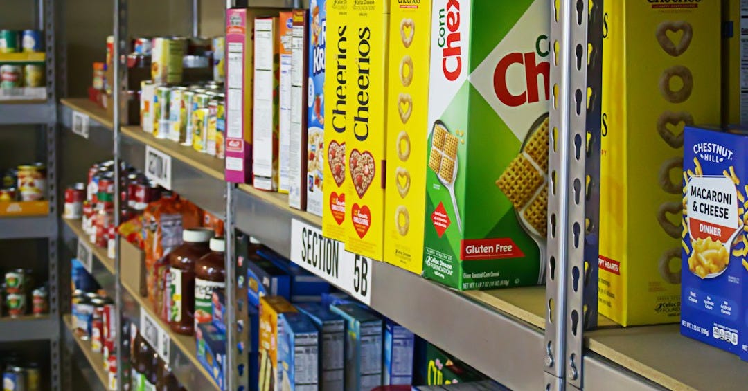 A shelf in a store filled with lots of food