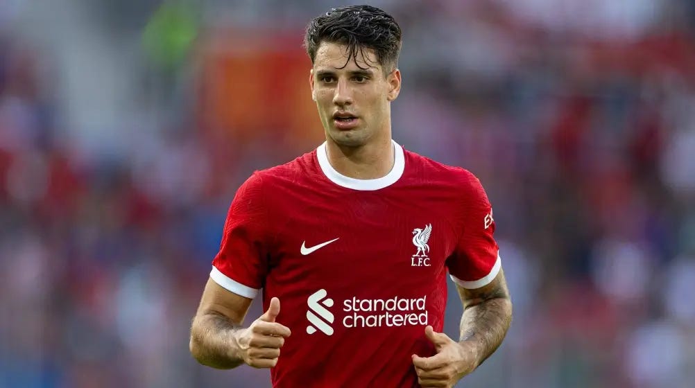 Liverpool player Dominik Szoboszlai wearing the home kit
