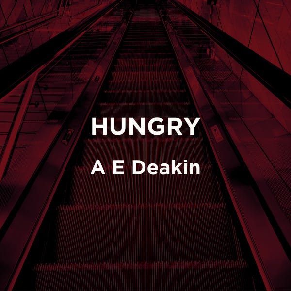 Dark red toned escalator going down. Text reads Hungry A E Deakin