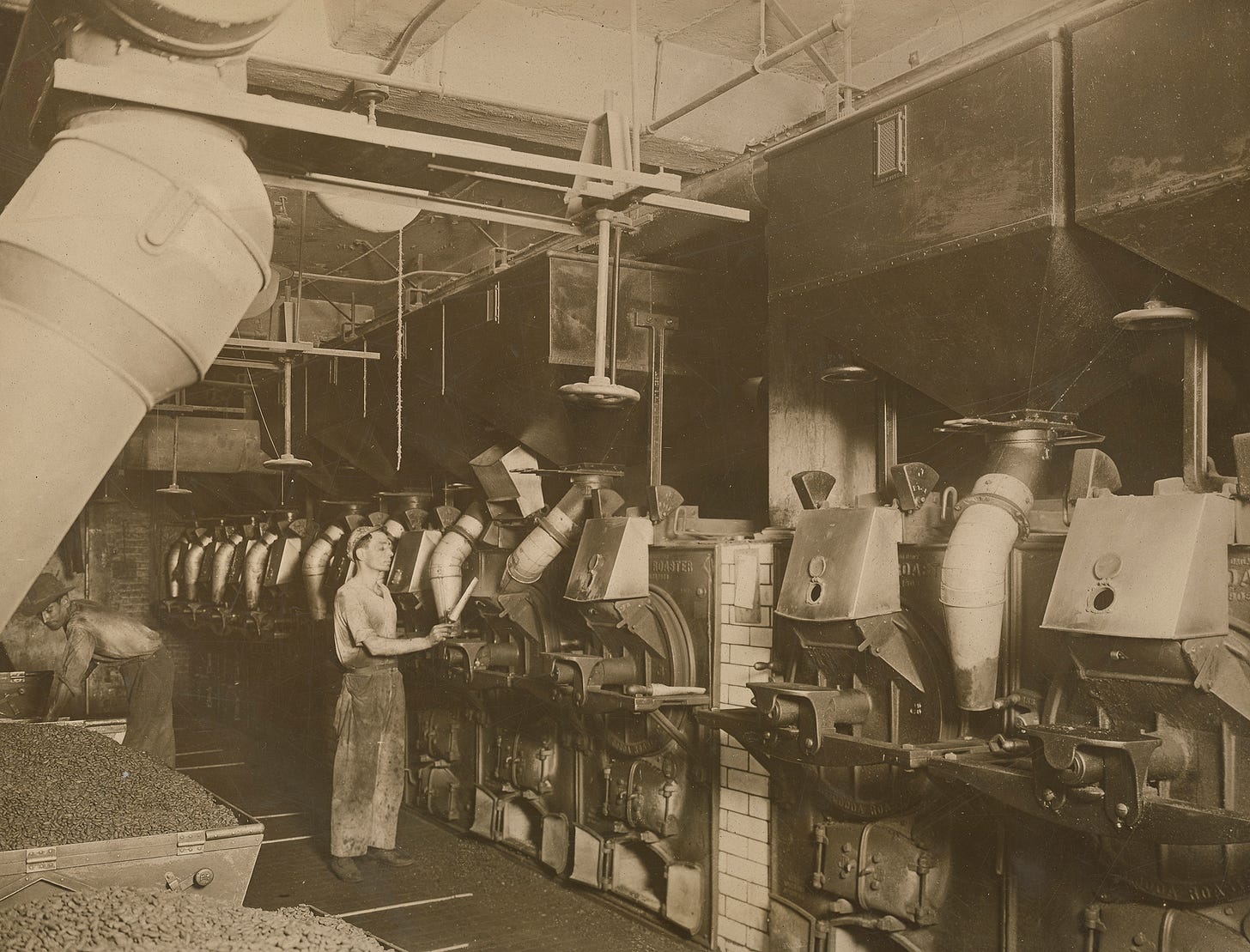 A worker in the Rockwood factory roasting cocoa beans in 1918 A worker in the Rockwood factory roasting cocoa beans in 1918