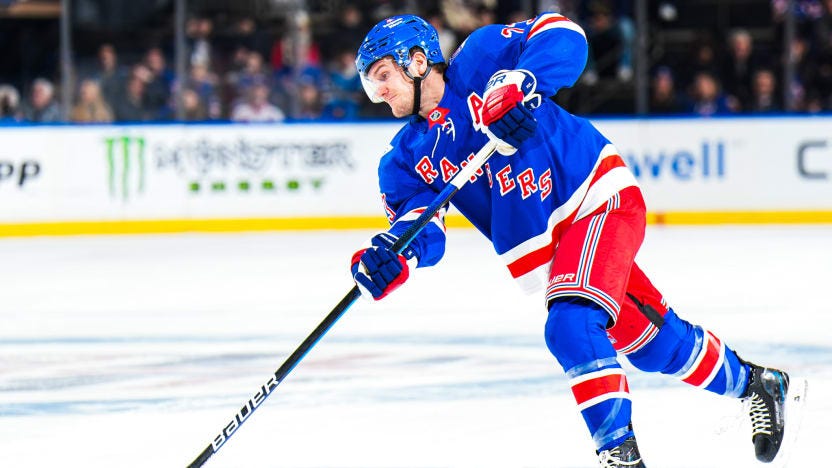 Rangers defenseman Adam Fox shoots the puck Rangers defenseman Adam Fox shoots the puck