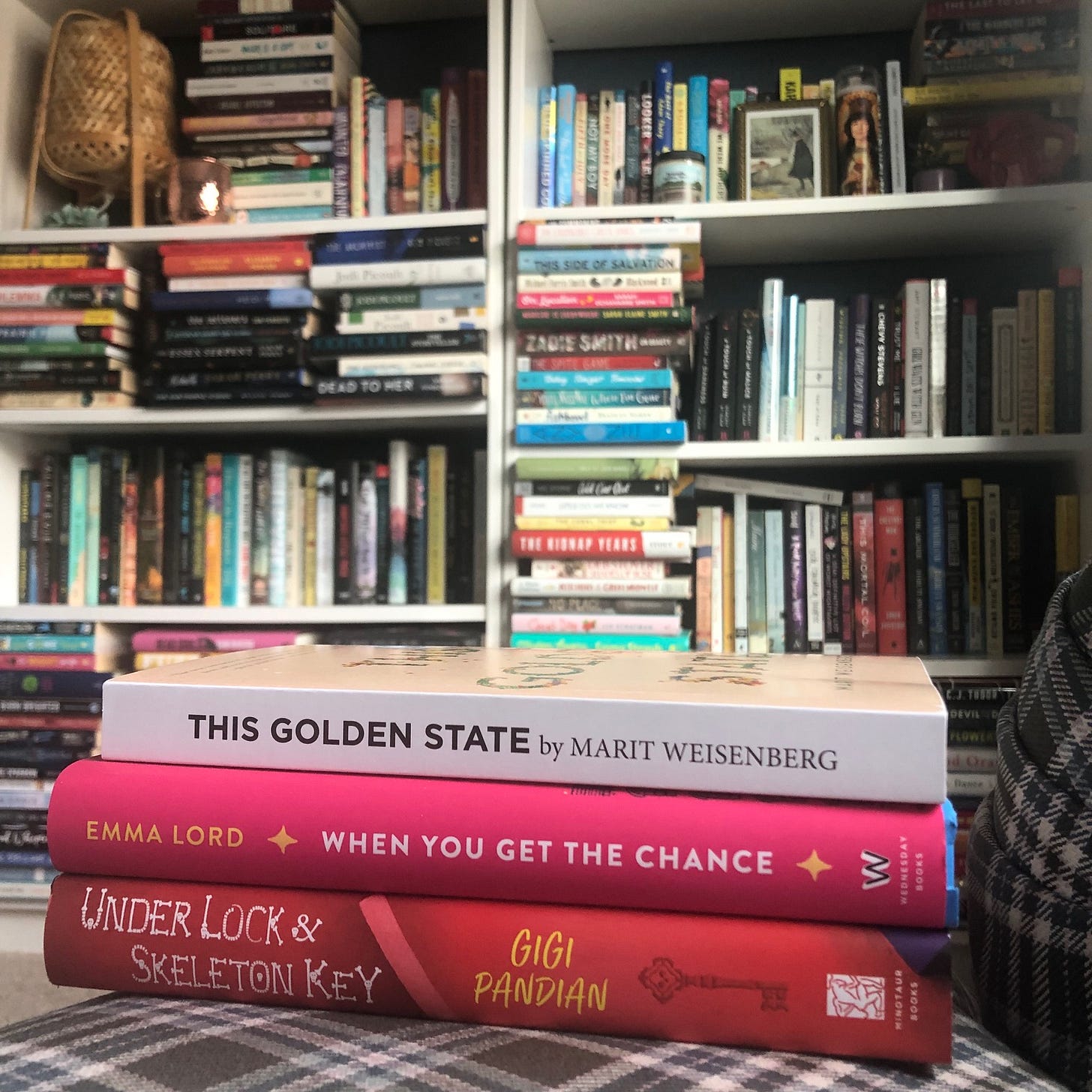 Books pictured: This Golden State by Marit Weisenberg, Under Lock & Skeleton Key by Gigi Pandian, and When You Get the Chance by Emma Lord. 