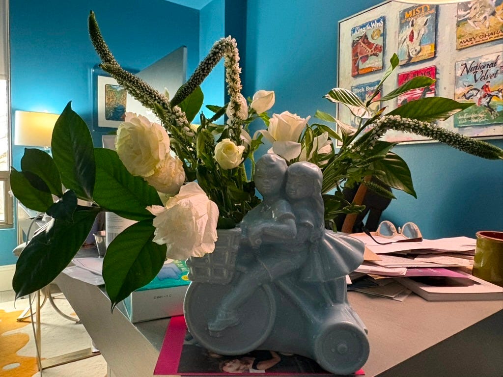 office desk holding a flower arrangement