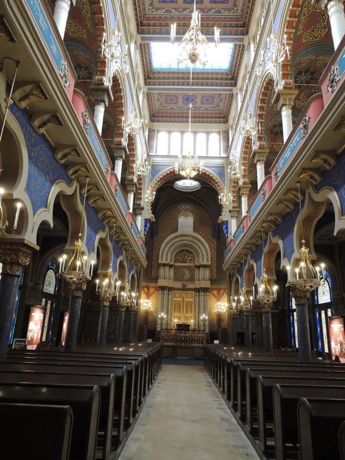 A large ornate building with stairs and stairs

AI-generated content may be incorrect.