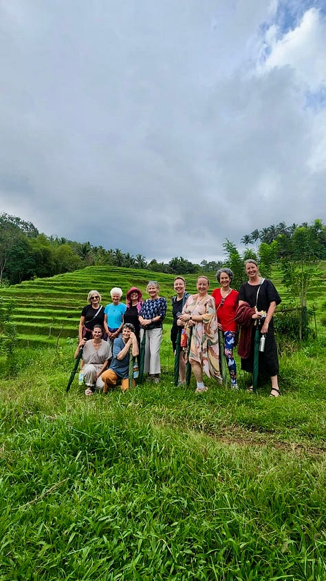 Women writing, participating in a Balinese blessing, standing by rice fields and swimming in a waterfall