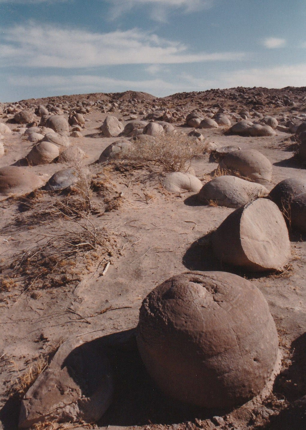 A desert valley full of round boulders A desert valley full of round boulders