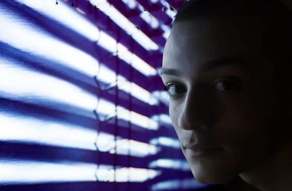 close up photo of person near neon lights