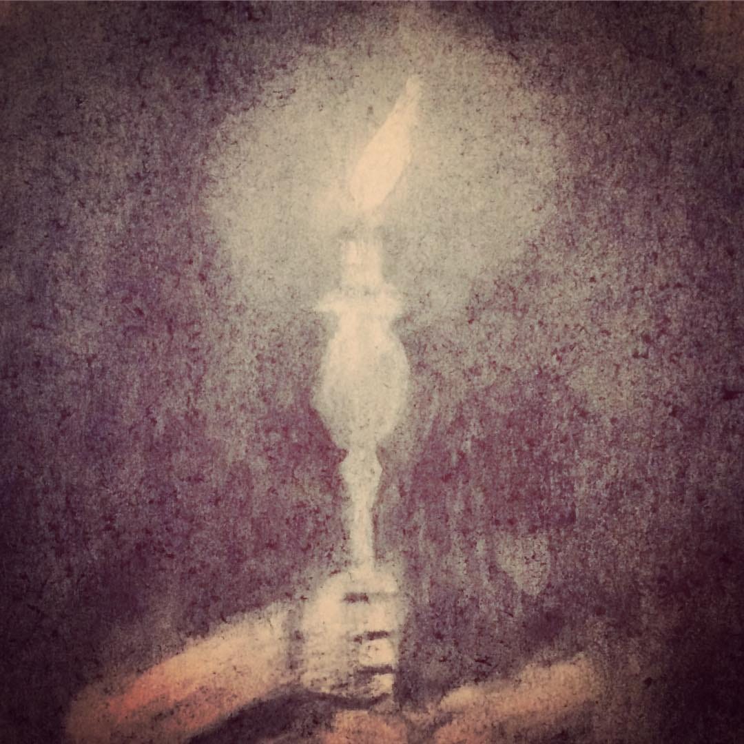 Youth holding up a candle